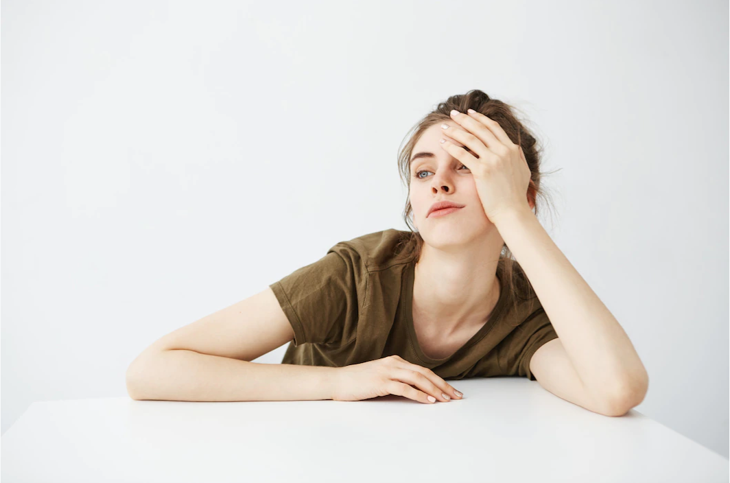 Tired woman leaning on her hand