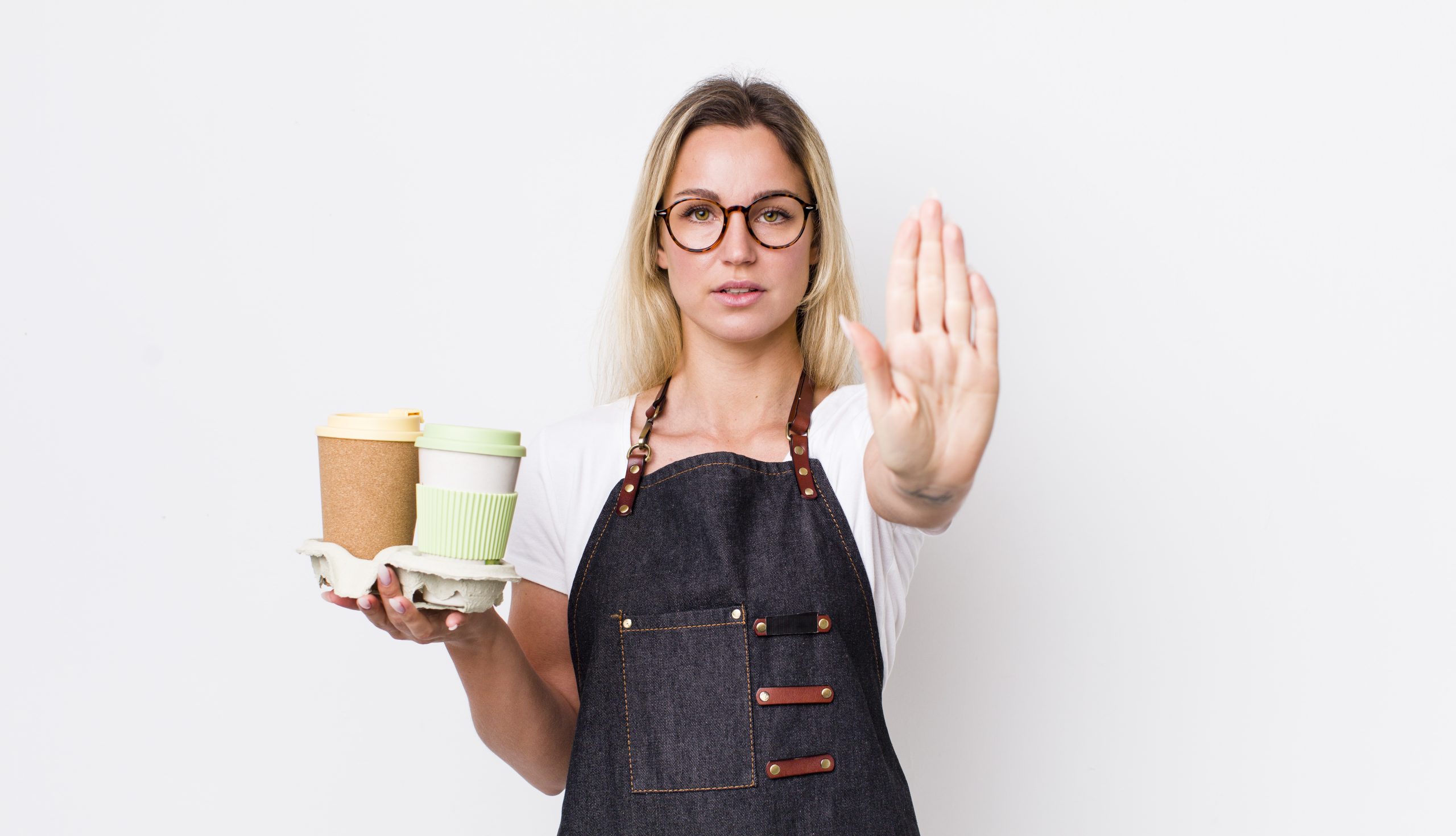 Woman with hand up to signal stop