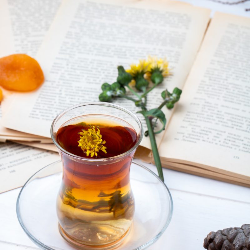 Clear glass of dandelion tea