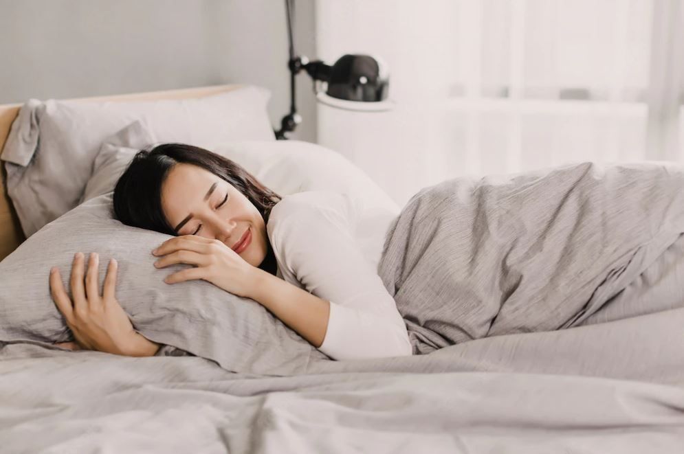 Woman sleeping in bed