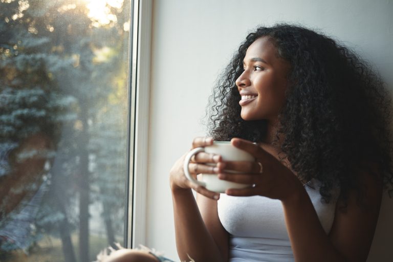 Morning routine. Portrait of happy charming young mixed race fem