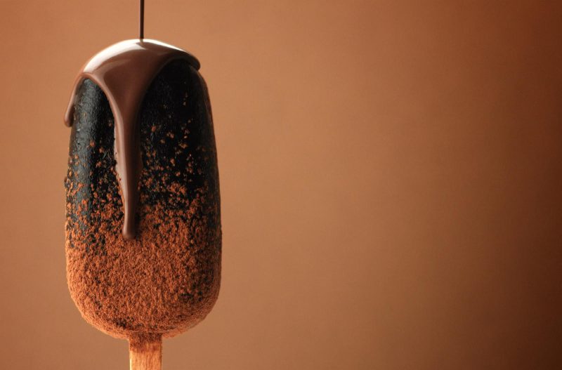 Chocolate bar on a stick with chocolate drizzled