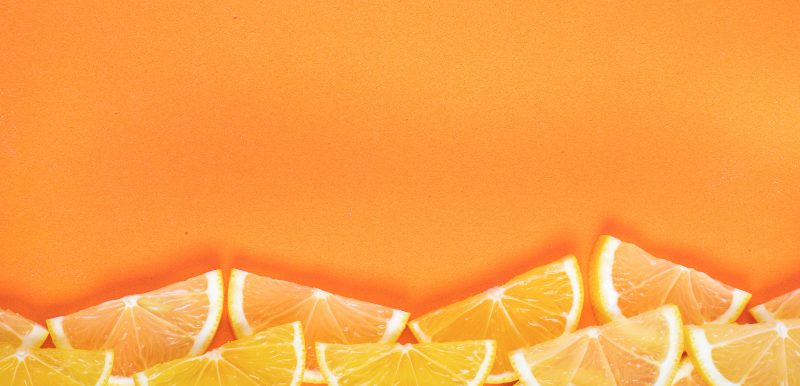 Orange background with orange slices at the bottom