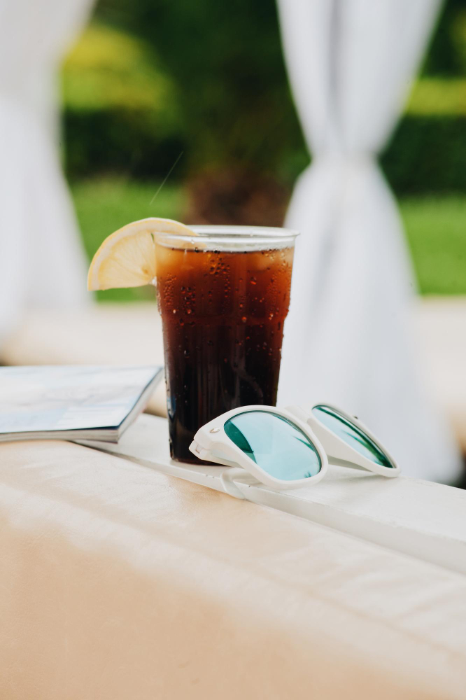 Close up of ice tea with sunglasses