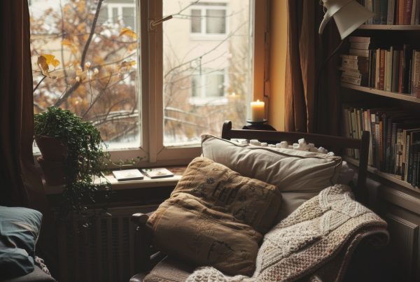 Cozy nook by a window and a candle