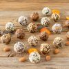 Rows of protein balls on a wood table