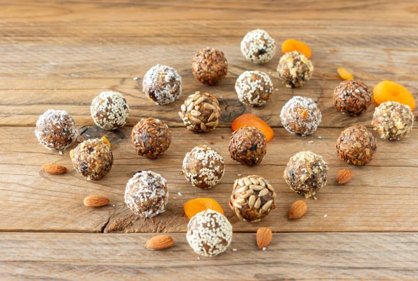 Rows of protein balls on a wood table