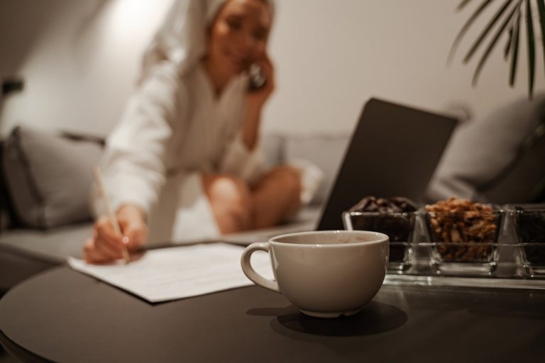 Woman at a table with a coffee cup