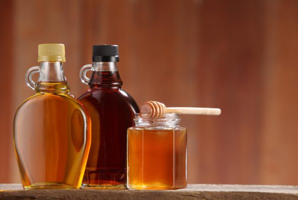 Close up of 3 honey jars