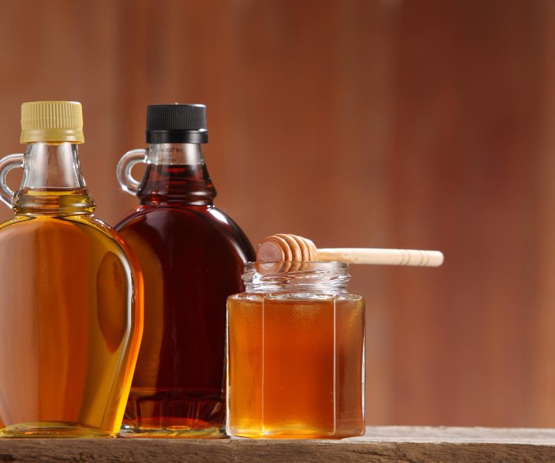 Close up of 3 honey jars