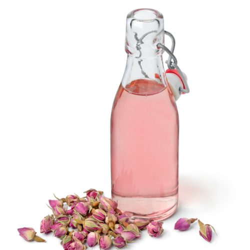 glass bottle of rose syrup