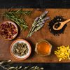 bowls of spices on a wood table