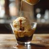 Affogato in a clear glass on a wood counter