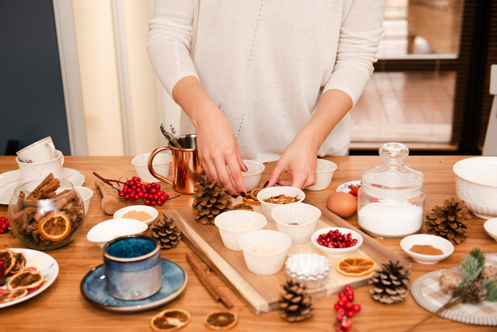 woman making a snack tray on a wood platter
