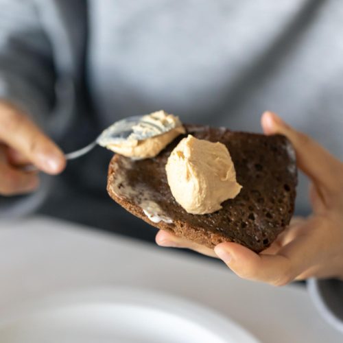 Spreading butter on bread