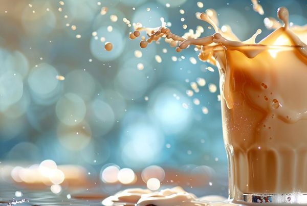 closeup of iced latte splashing when ice is added