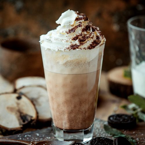 Iced Latte with whipped cream close up