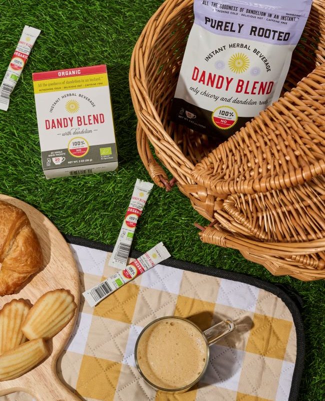 Purely Rooted in a picnic basket on grass