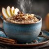 Steaming bowl of oatmeal with apple slices and raisins