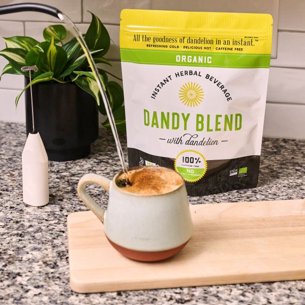 11 oz Organic Green Bag on a counter with a cup of Dandy Blend