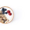 a bowl of yogurt with granola and berries