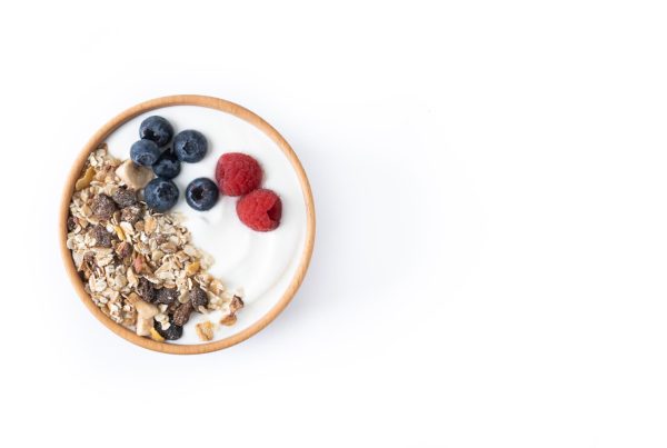 a bowl of yogurt with granola and berries